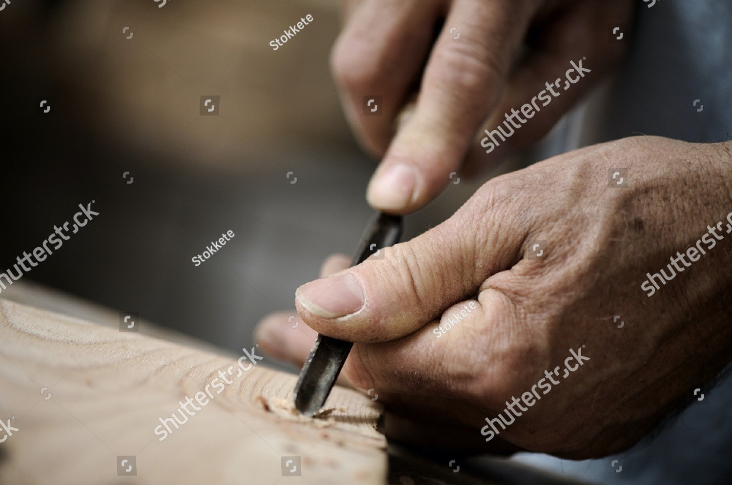 stock-photo-hands-of-the-craftsman-carve-a-bas-relief-with-a-gouge-93760546